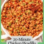 A quick chicken picadillo skillet with raisins and cilantro and a wooden spoon resting in the dish with a green border and text around the photo.