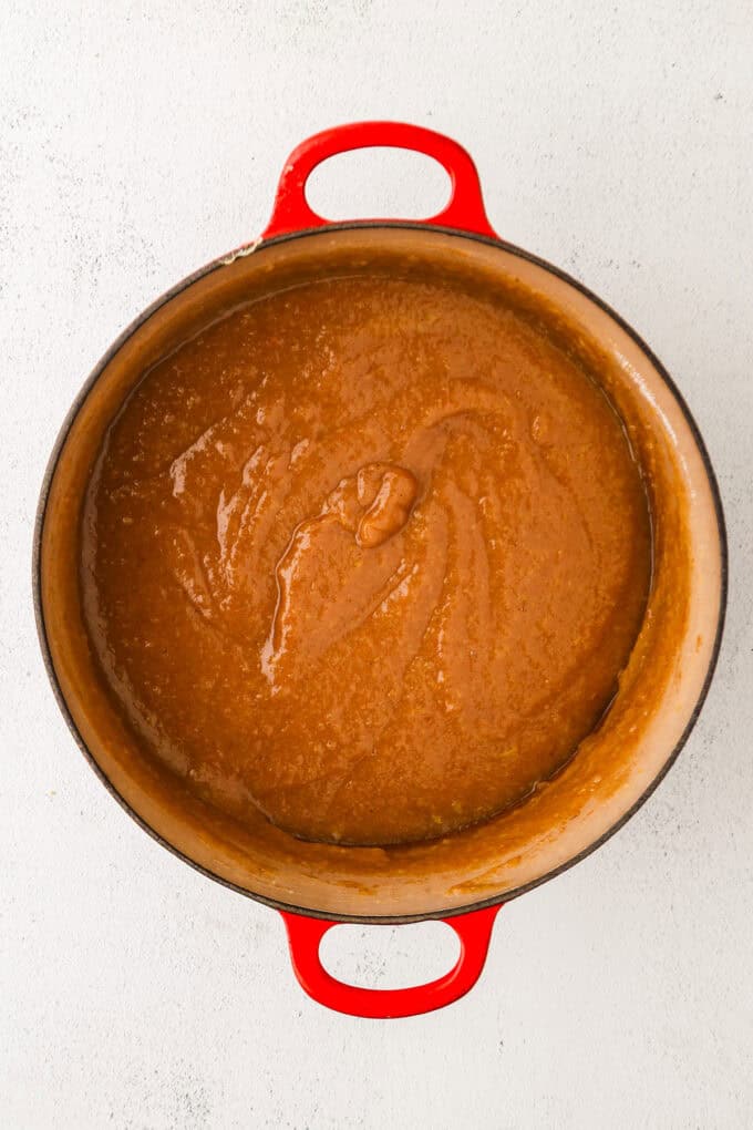 Smooth pureed apple butter in a dutch oven.